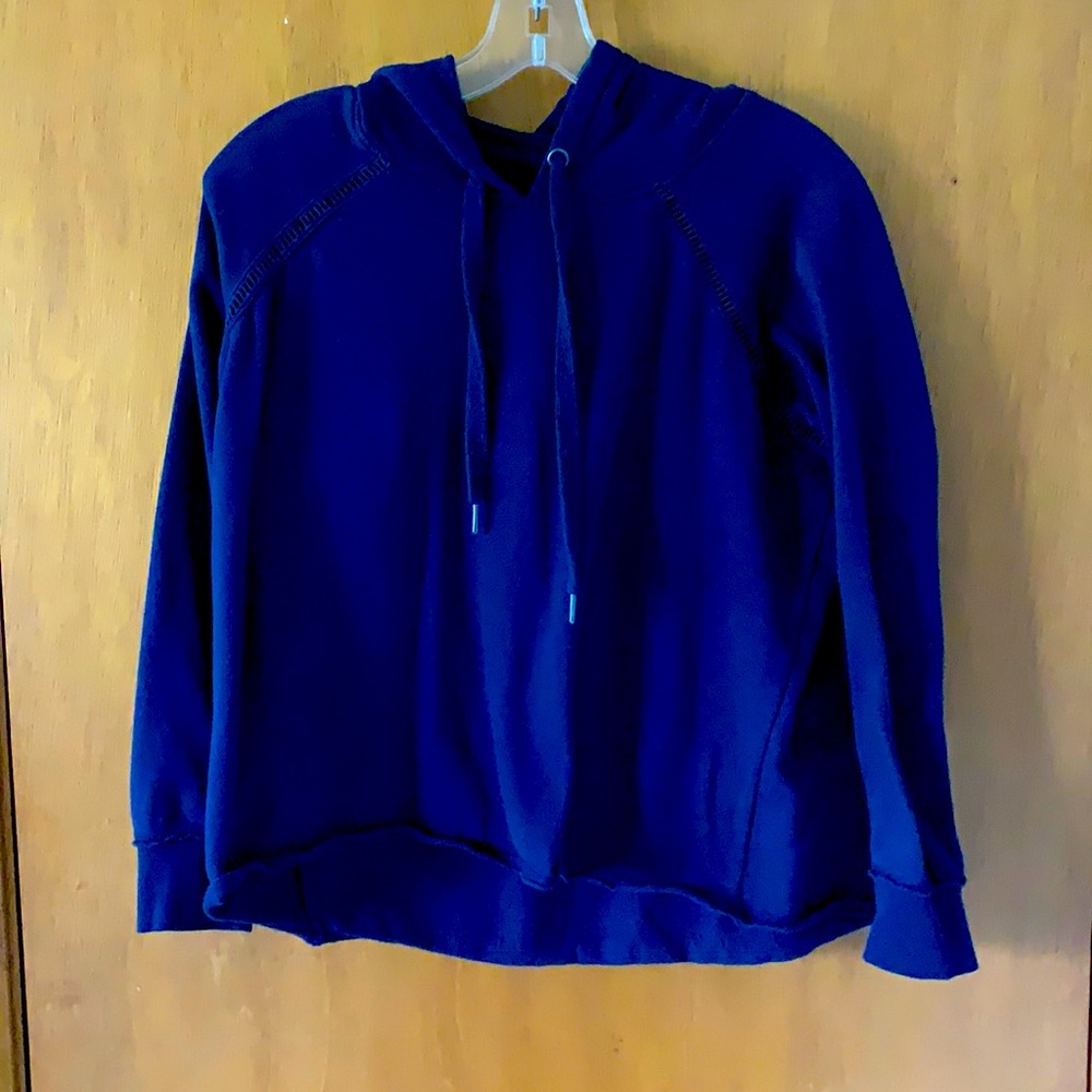 Blue sweatshirt with shear detailing around chest